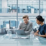 Multiethnic Diverse Office Conference Room Meeting: Team of Two Creative Entrepreneurs Talk, Discuss Growth Strategy. Stylish Young Businesspeople work on Investment and Marketing Projects. Australia | Hide the Screen Sharing Bar in Microsoft Teams Calls: One Easy Step