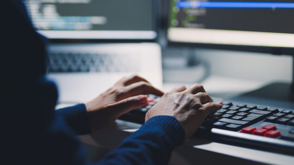 Closeup hand of developer programmer, soffware engineer, IT support, typing on computer keyboard United Kingdom|Business Intelligence Consulting Services